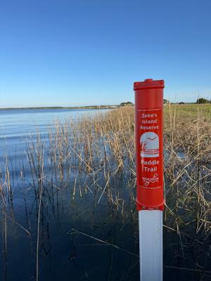 Orange pole marking the Zeke's Island paddle trail