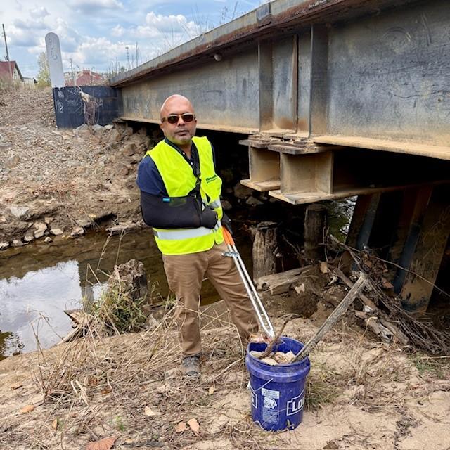 Secretary Sangvai volunteers with MountainTrue for waterway debris clean up. 