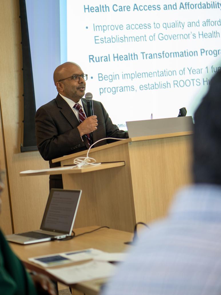 Secretary Sangvai speaking to federal CMS officials