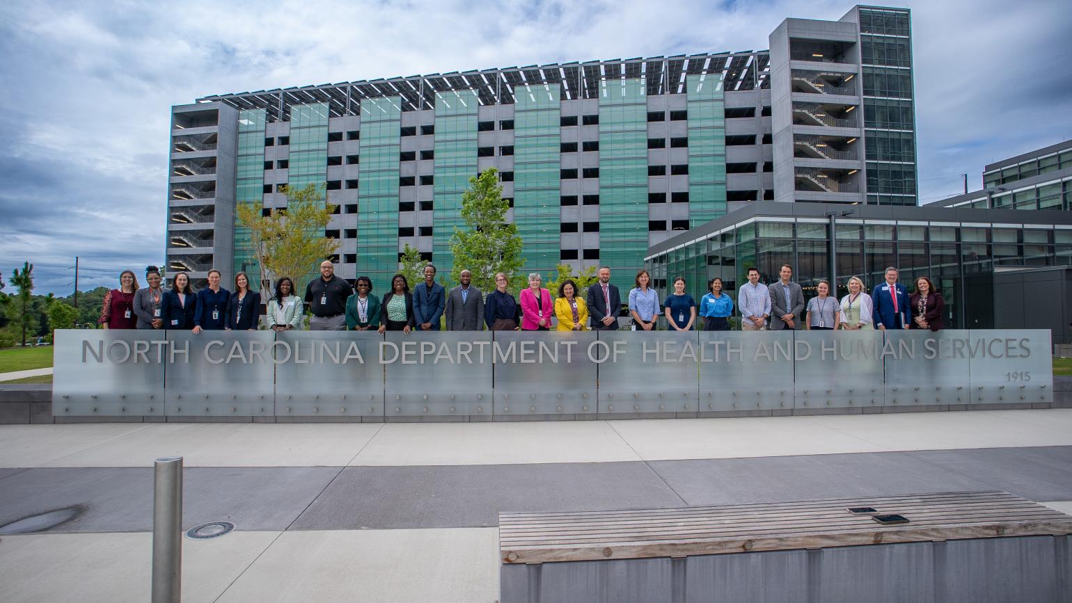 Federal CMS and state NCDHHS officials outside of NCDHHS headquarters.