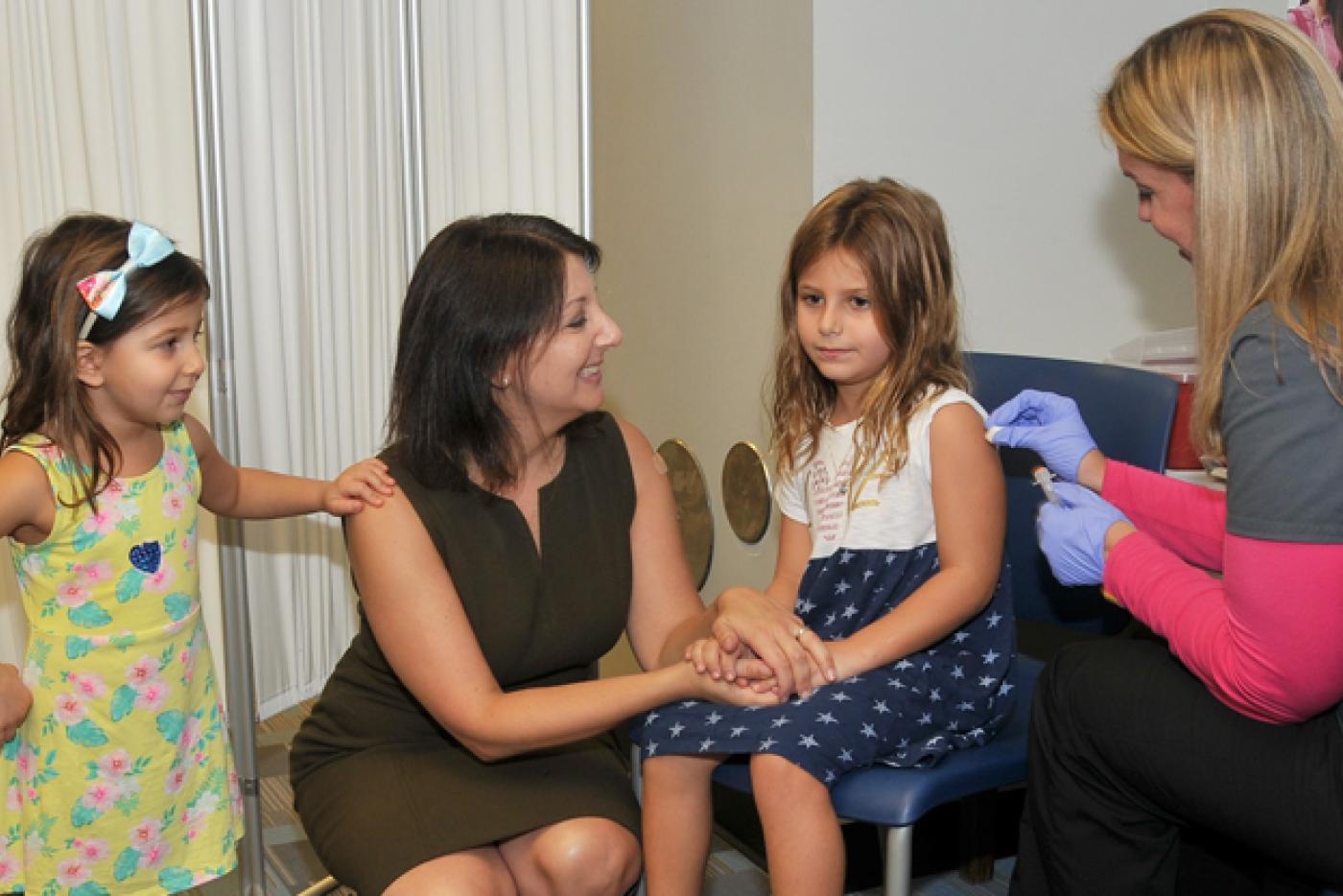 DHHS Secretary Mandy Cohen and her daughters received their flu vaccinations