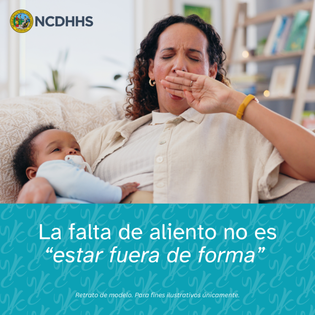 A woman holding infant