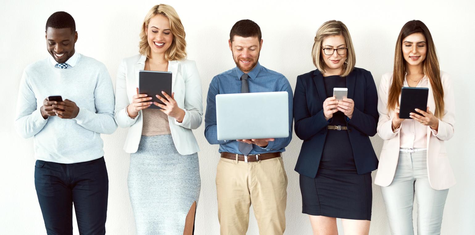 Group of people hold different screen sizes of technology
