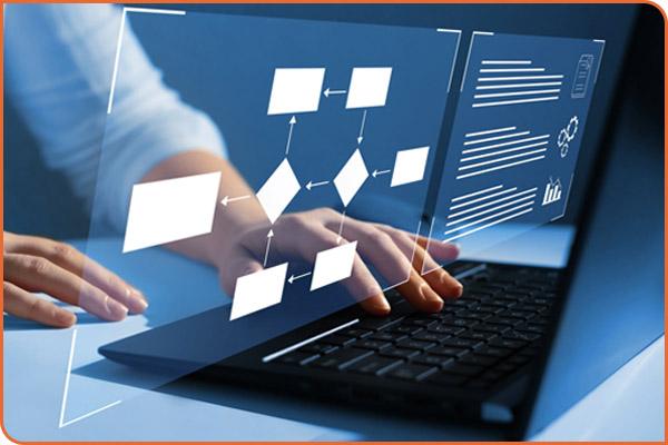 A process flow chart hovers above hands typing on a laptop.