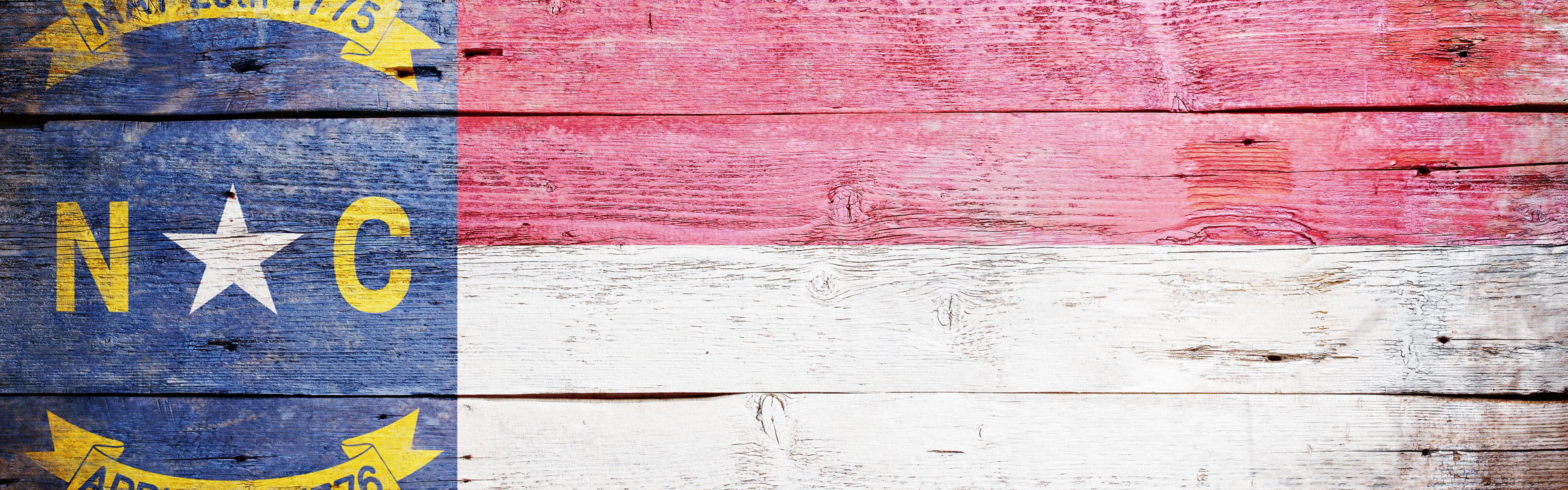 NC flag painted on wood