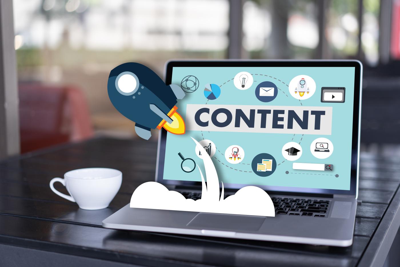 Rocket ship that starts from the computer screen that has word "content"