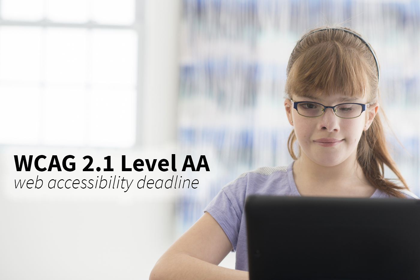 A young girl with visual impairment and facial differences surfs the web. The WCAG 2.1 Level AA web accessibility deadline is 4/24/26.