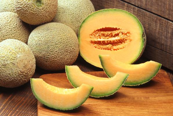 fresh ripe cantaloupes whole and sliced open