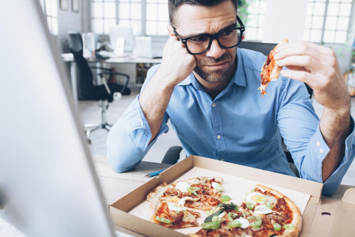 man looking at gross pizza