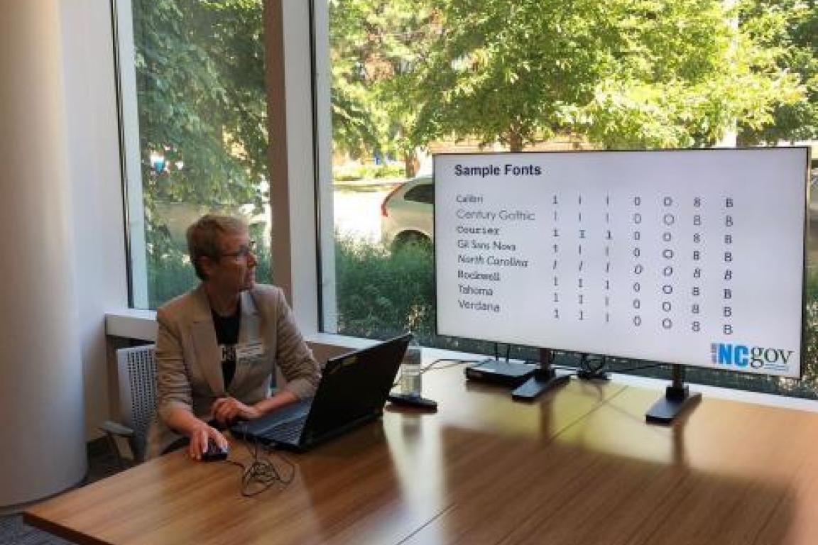 woman presenting at the tv screen