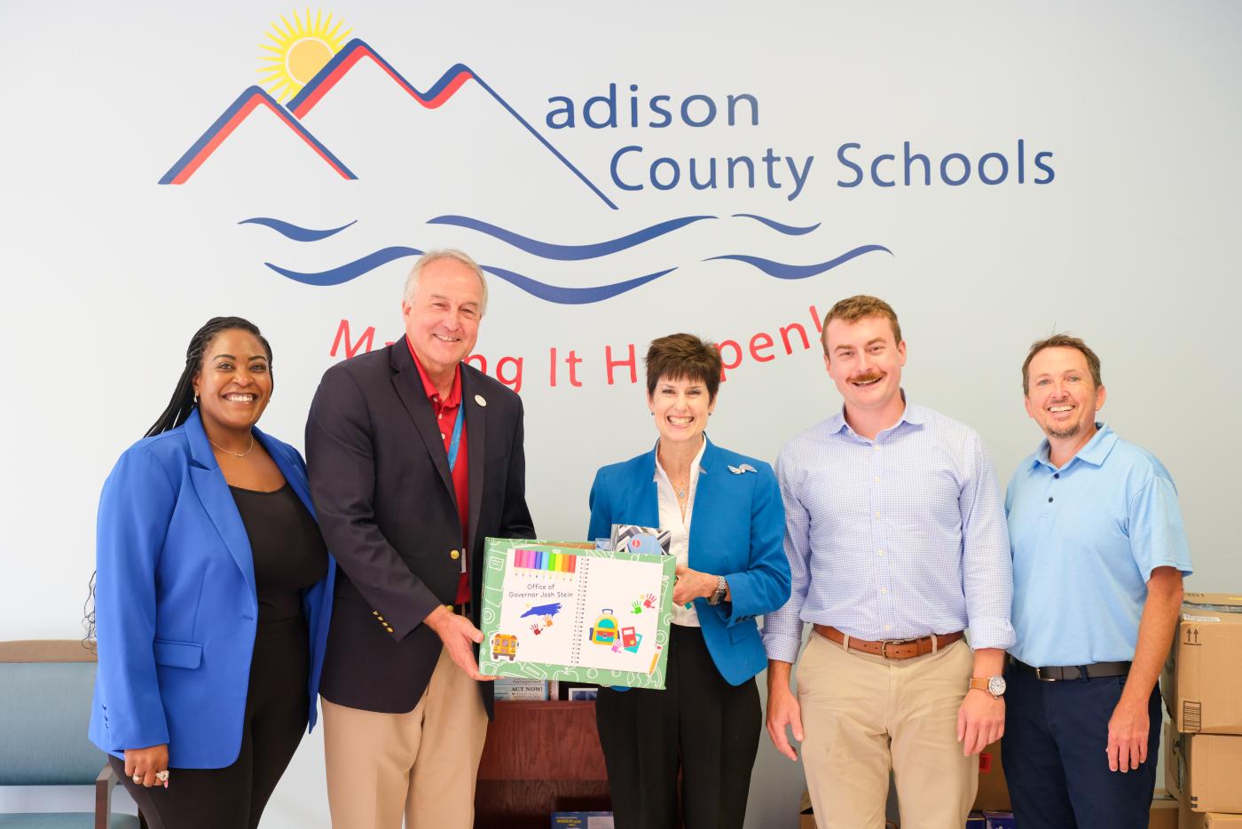 Teena Piccione, Dylan Frick and Alysa Kelly with staff from Madison County Schools