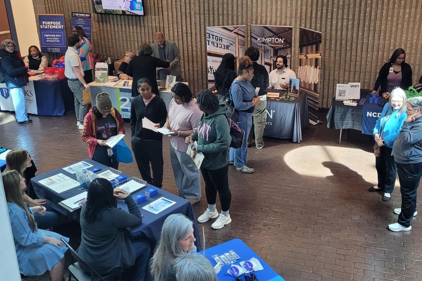 Human Resources recruiter Samika Lewis meets with students and job-seekers at the Forsyth Technical Community College Business and IT Career Fair on April 8.