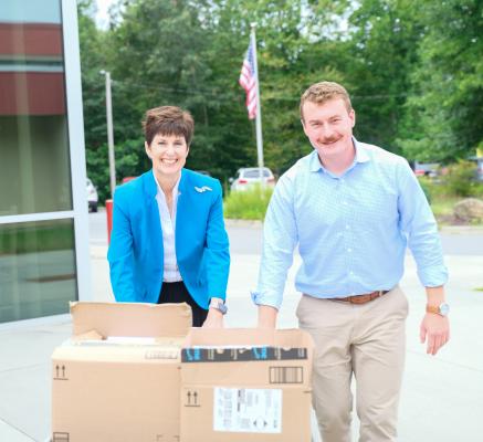 Teena Piccione and Dylan Frick delivering school supplies