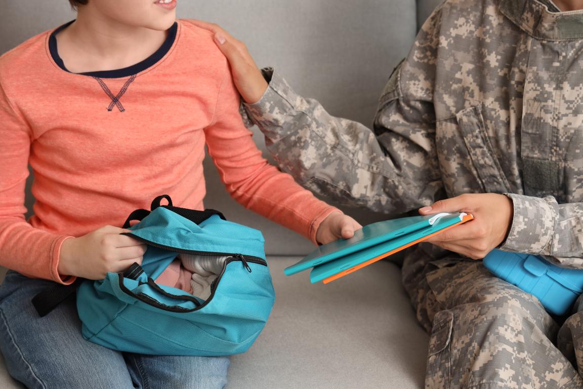 Military parent sitting with their child