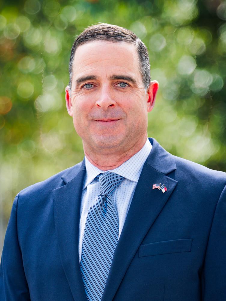 Photo of Chief Mixon in a blue suit.