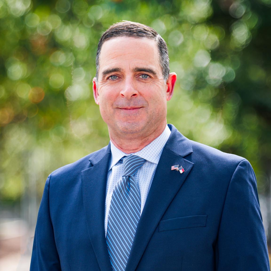 Photo of Chief Mixon in a blue suit.