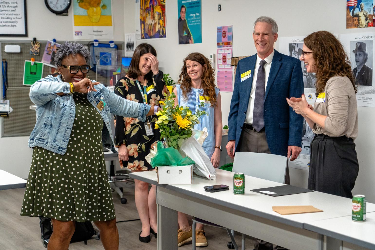 Former secretary Reid Wilson posing with teachers