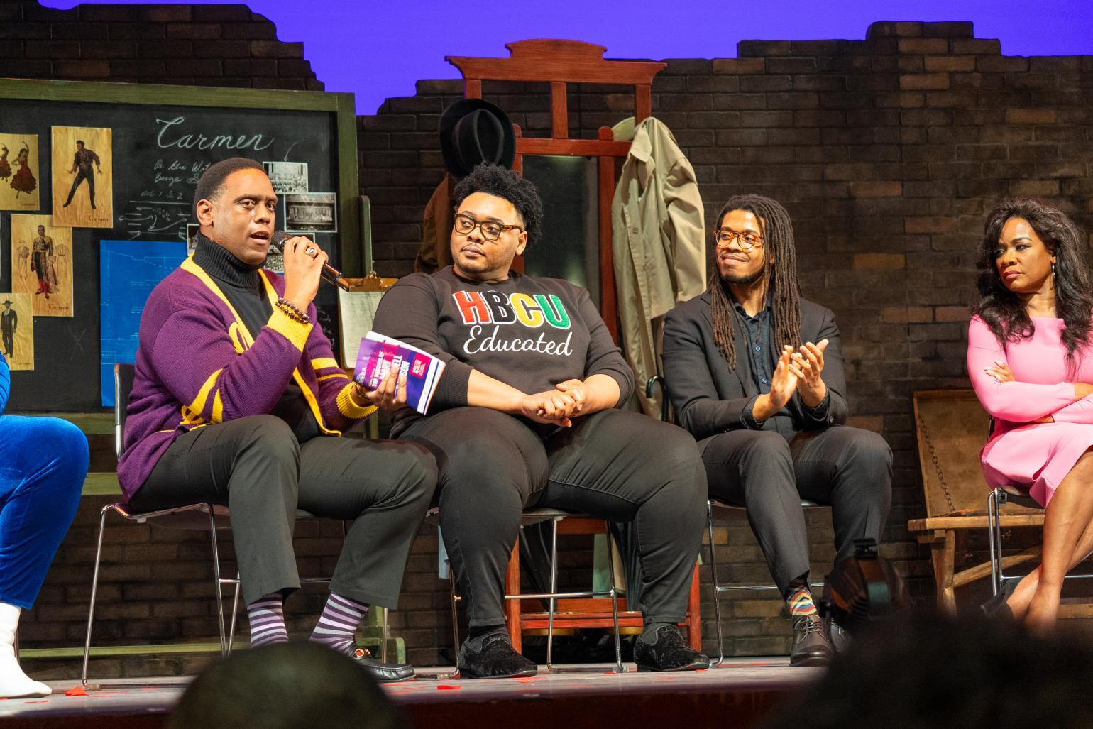 Performers are interviewed on stage.