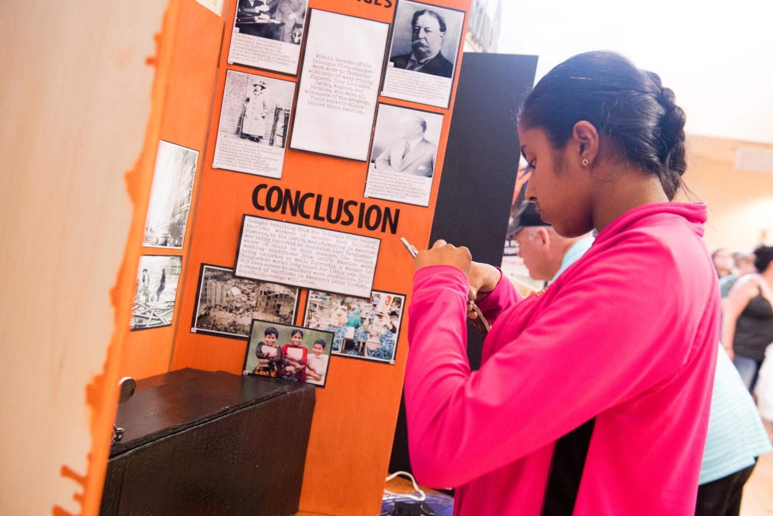 A student works on building an exhibit.
