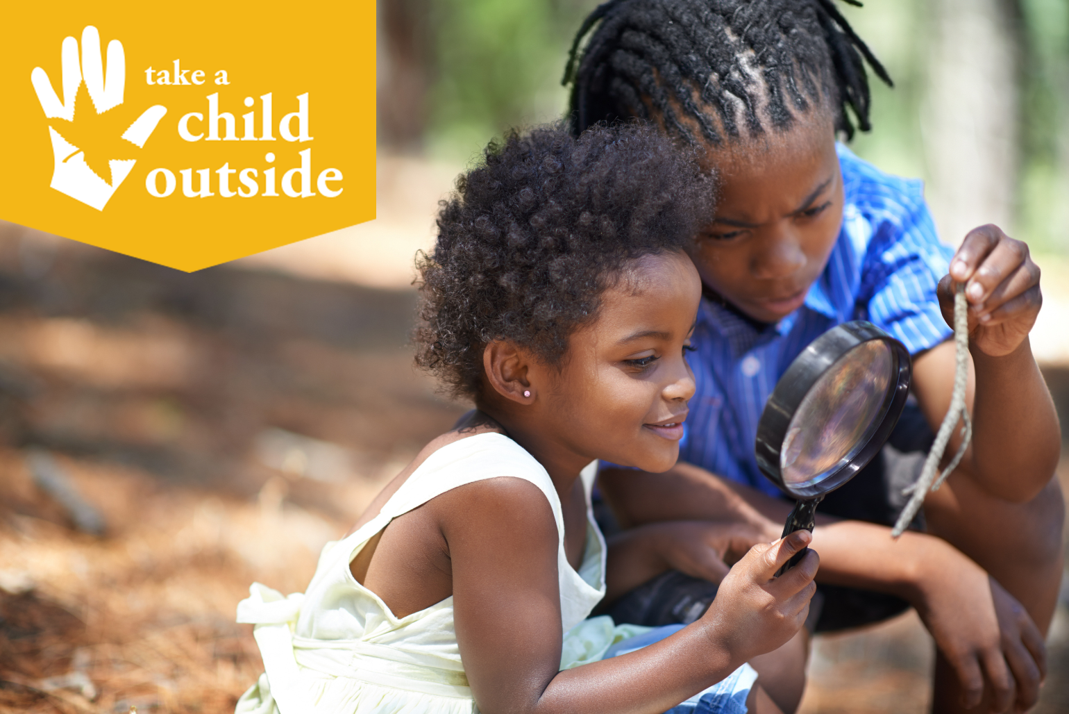 Two Children Study a Stick