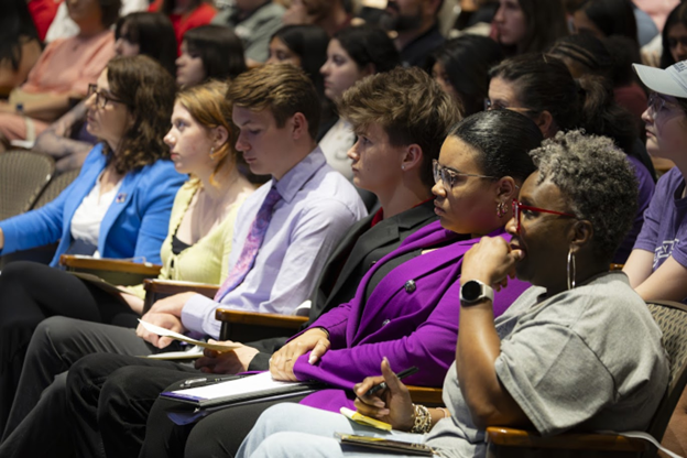 Valencia watches the interview in the audience.
