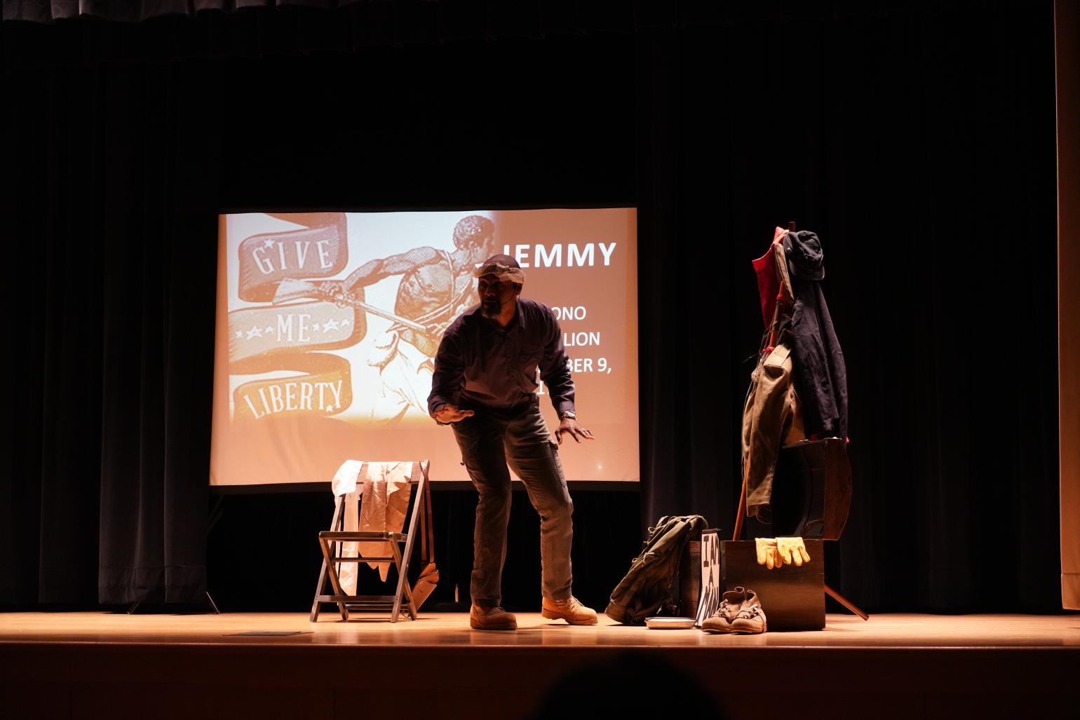 Sonny Kelly performs on stage.