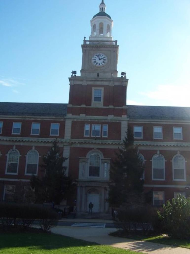 Tim stands in front of Howard University's library.