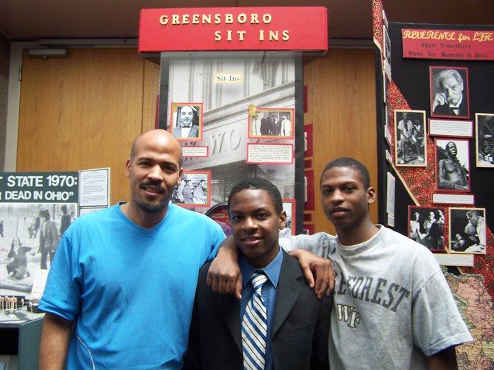 Tim with his uncle and brother in 2006 in front of his exhibit. 