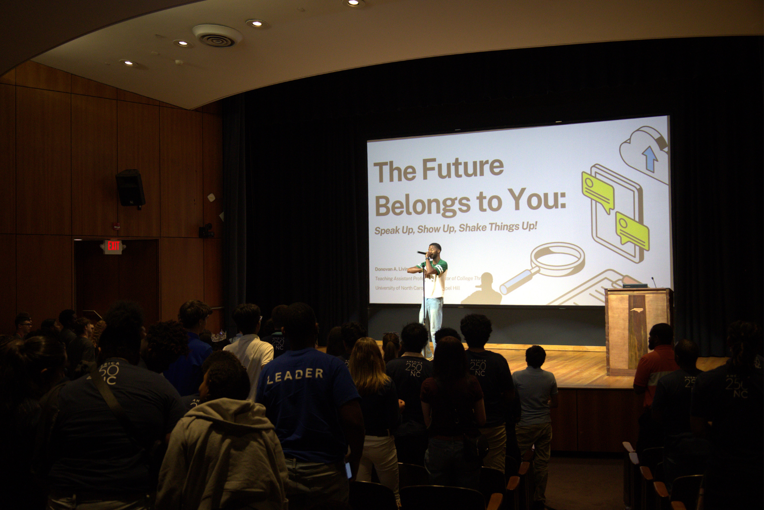 A speaker inspires the audience about getting involved in civics.