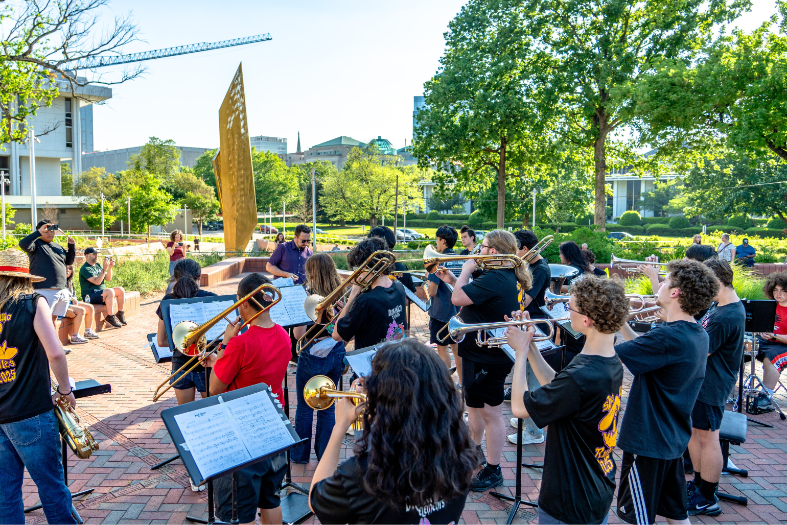 Middle Creek band students perform in Freedom Park.