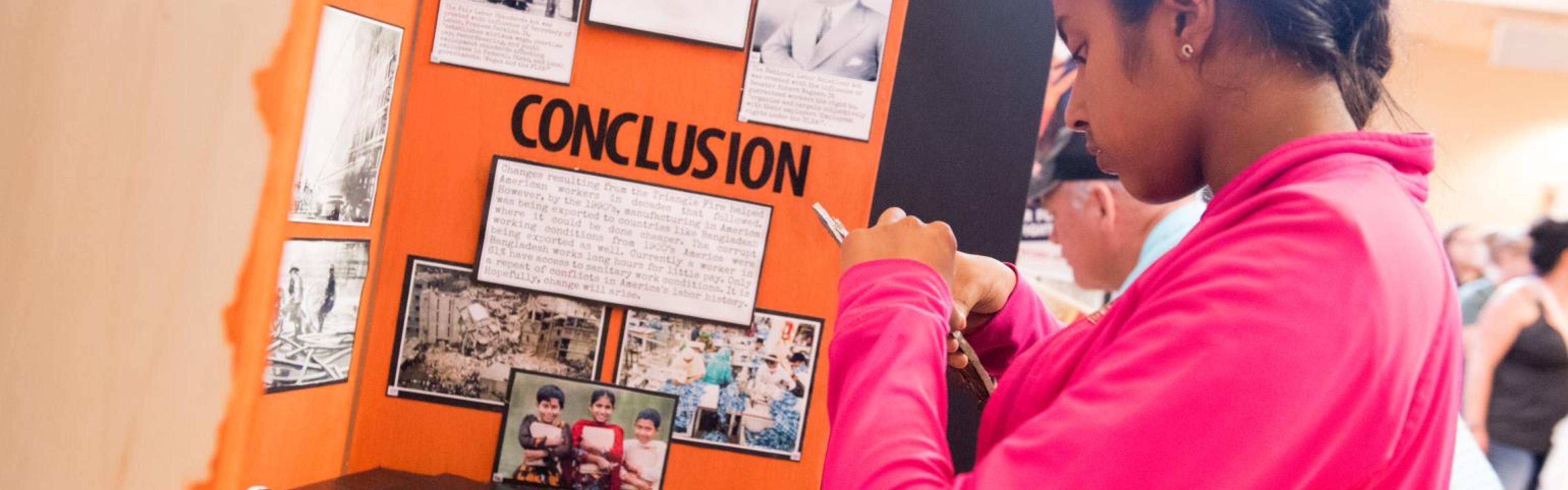 A student works on building an exhibit.