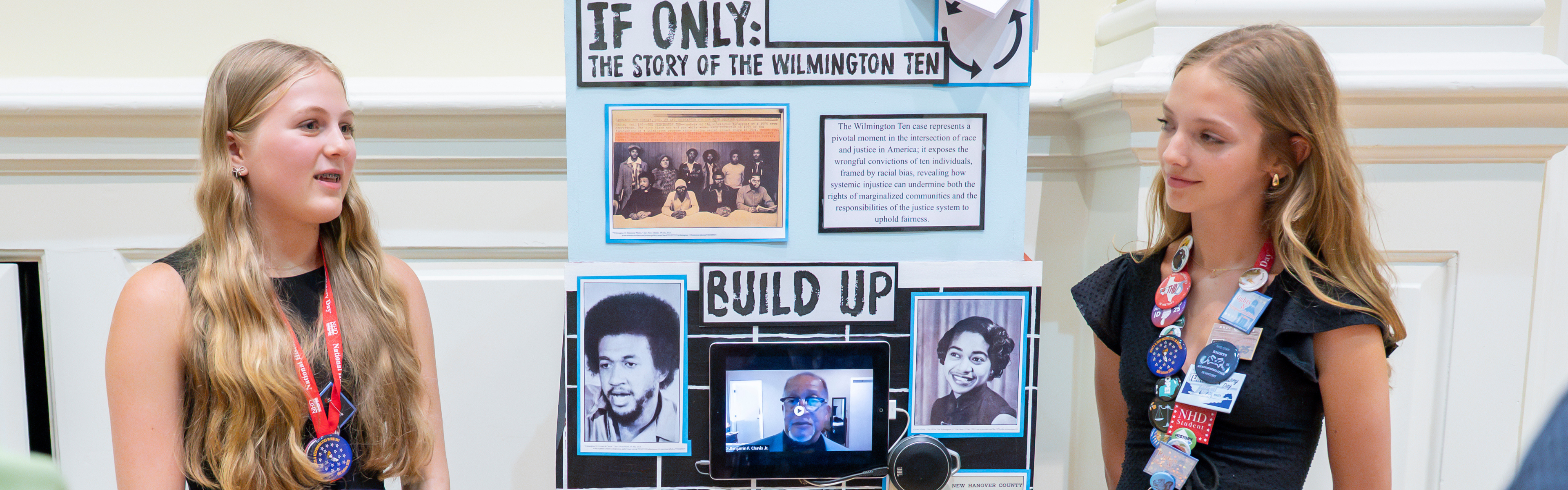 Two students present their exhibit.