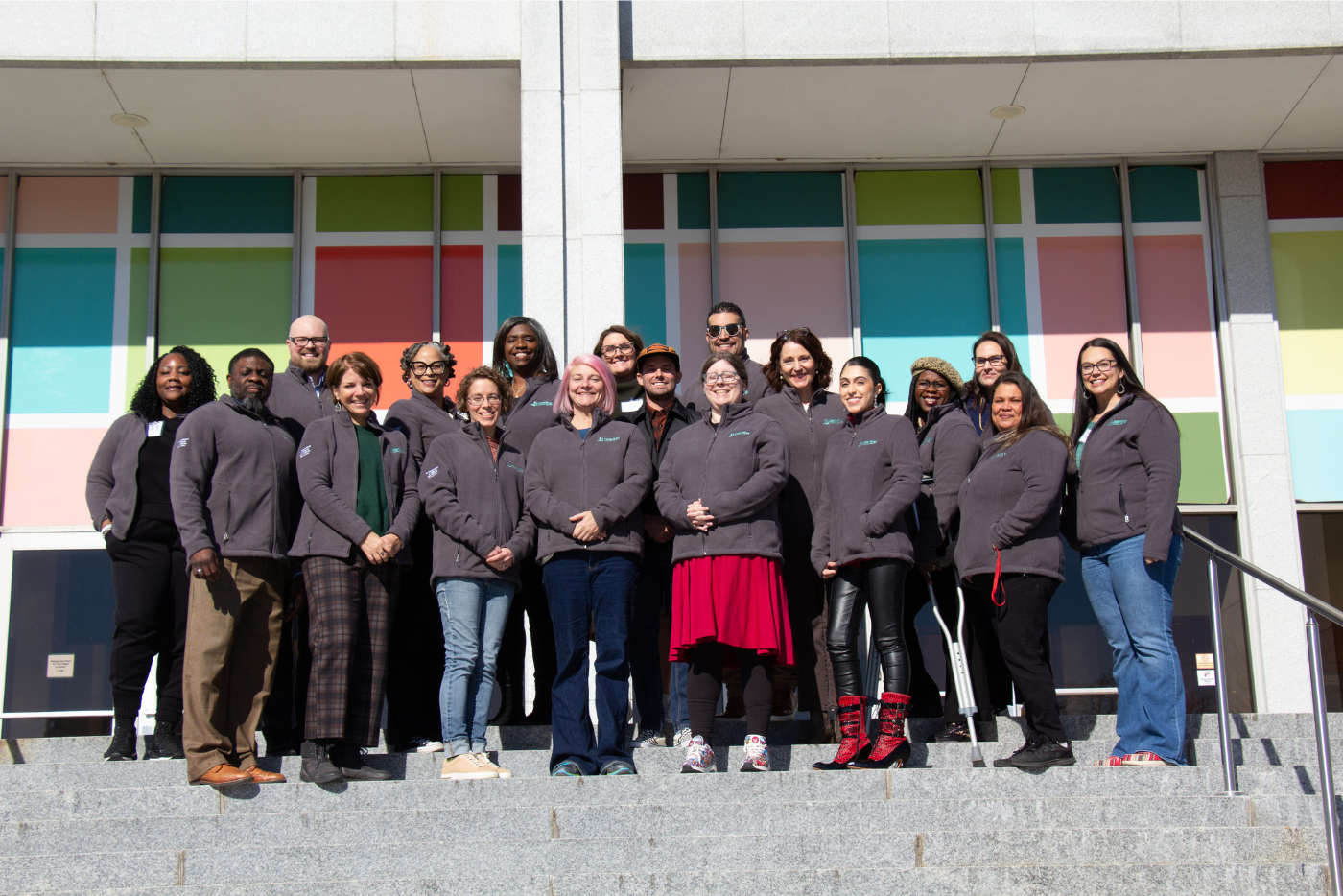 18 DNCR Learning Happens Here Teacher Ambassadors stand on the steps of DNCR.