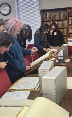 teachers look through archival materials