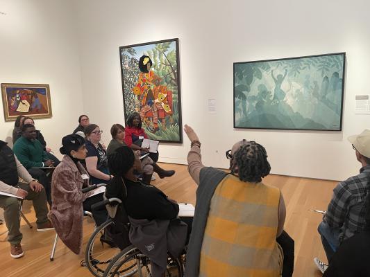 people looking at art in a museum