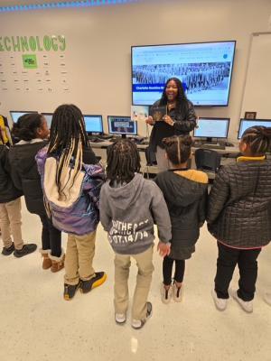 a teacher showing students a screen