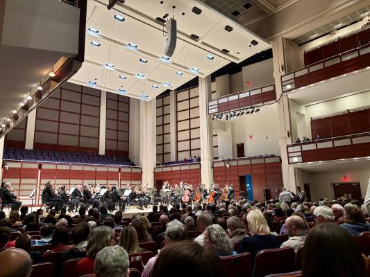 view of a stage from the audience at a symphony performance