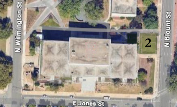 grassy corner lot with the number '2' in the center 
