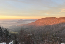 Sunrise over a snow-covered mountain range