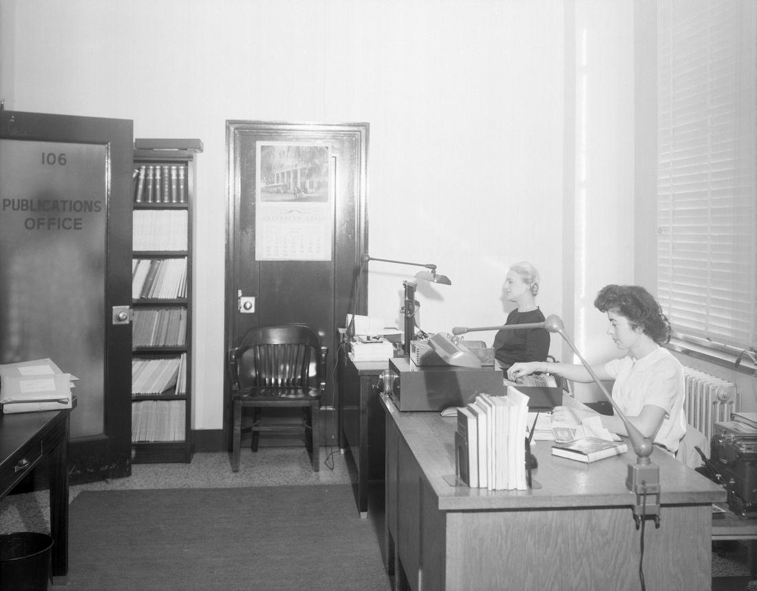 B&W - two women sitting at a desk