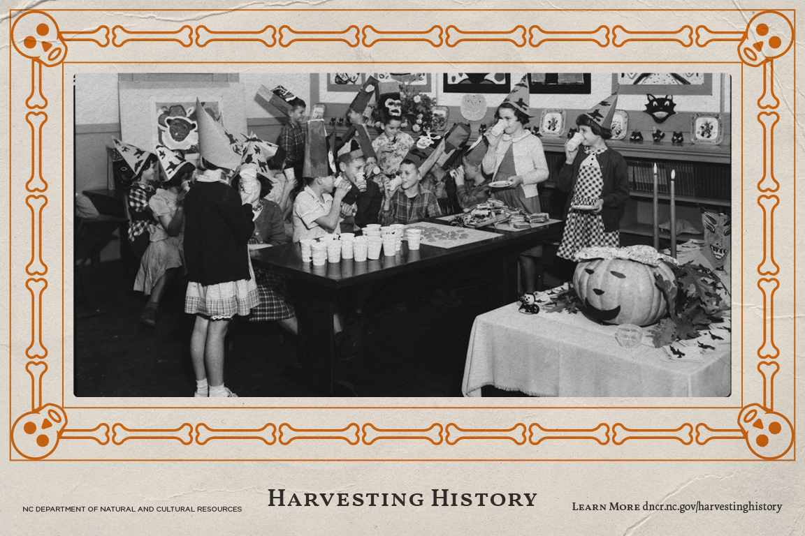 Black and white archival image of children having a halloween party with a decorative orange skeleton boarder