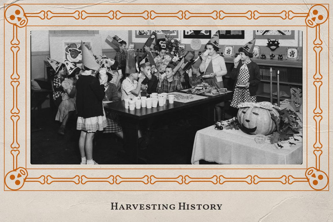 Black and white archival image of children having a halloween party with a decorative orange skeleton boarder