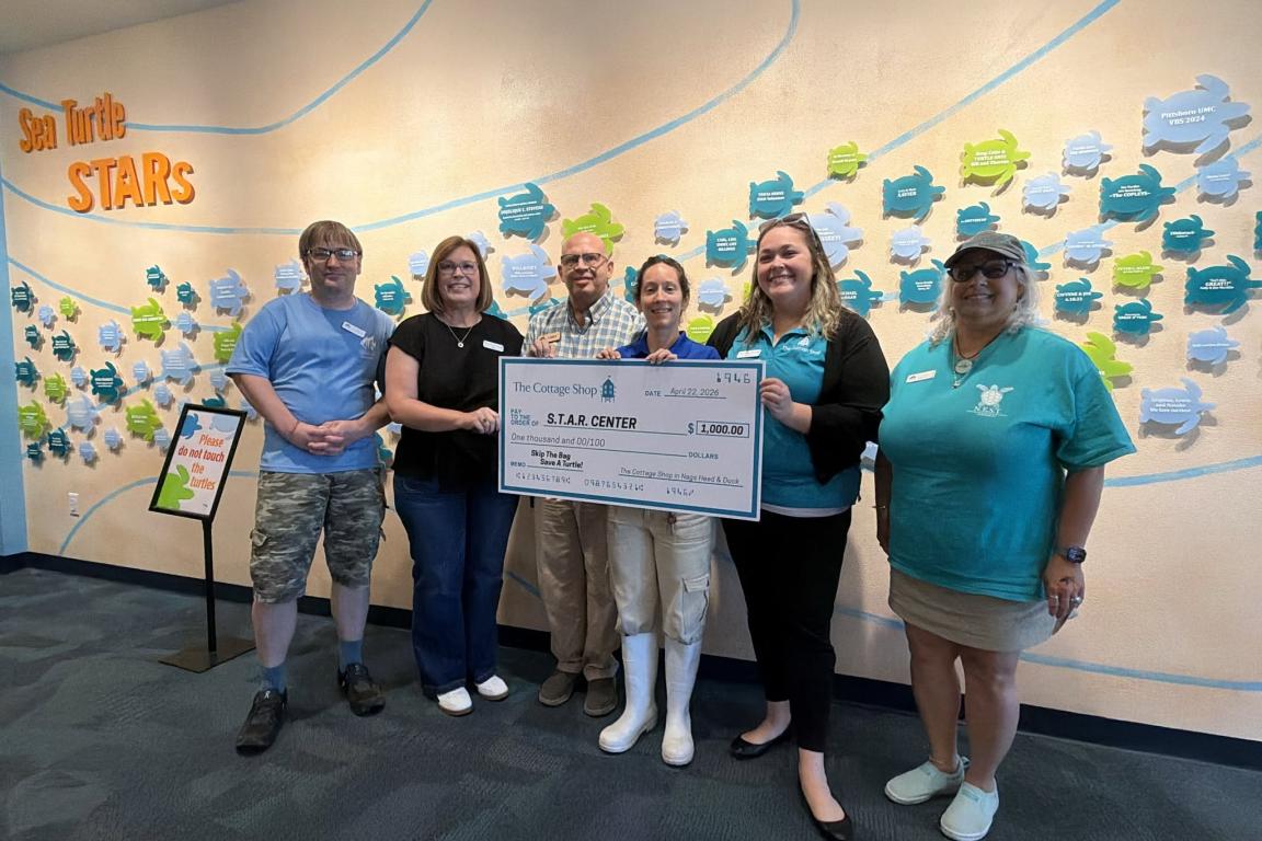 The North Carolina Aquarium on Roanoke Island recently received a $1,000 donation for its Sea Turtle Assistance and Rehabilitation (S.T.A.R.) Center.