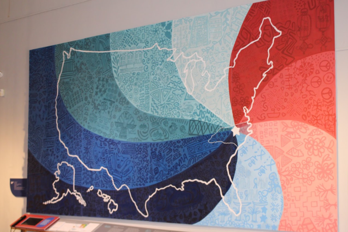 Mural created by artist Adriana Ameigh from participating English language learners’ drawings was the centerpiece of the exhibit, “Patterns of Belonging.”