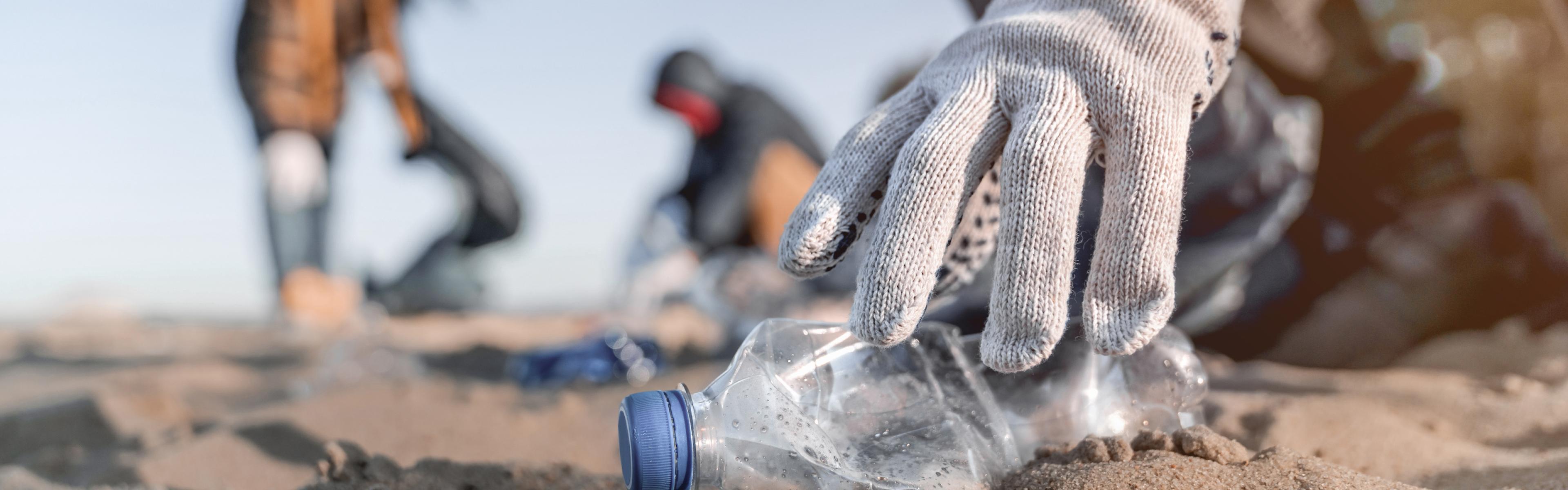 Volunteers picking up litter on the beach.