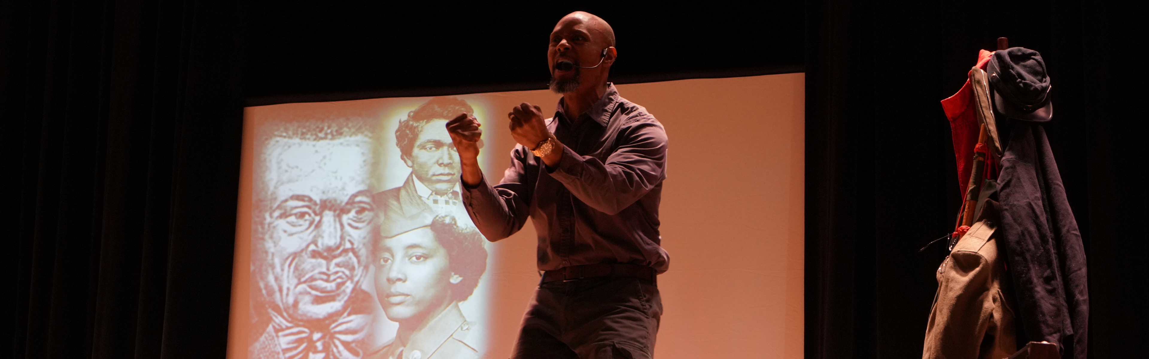 Sonny Kelly performs on stage.