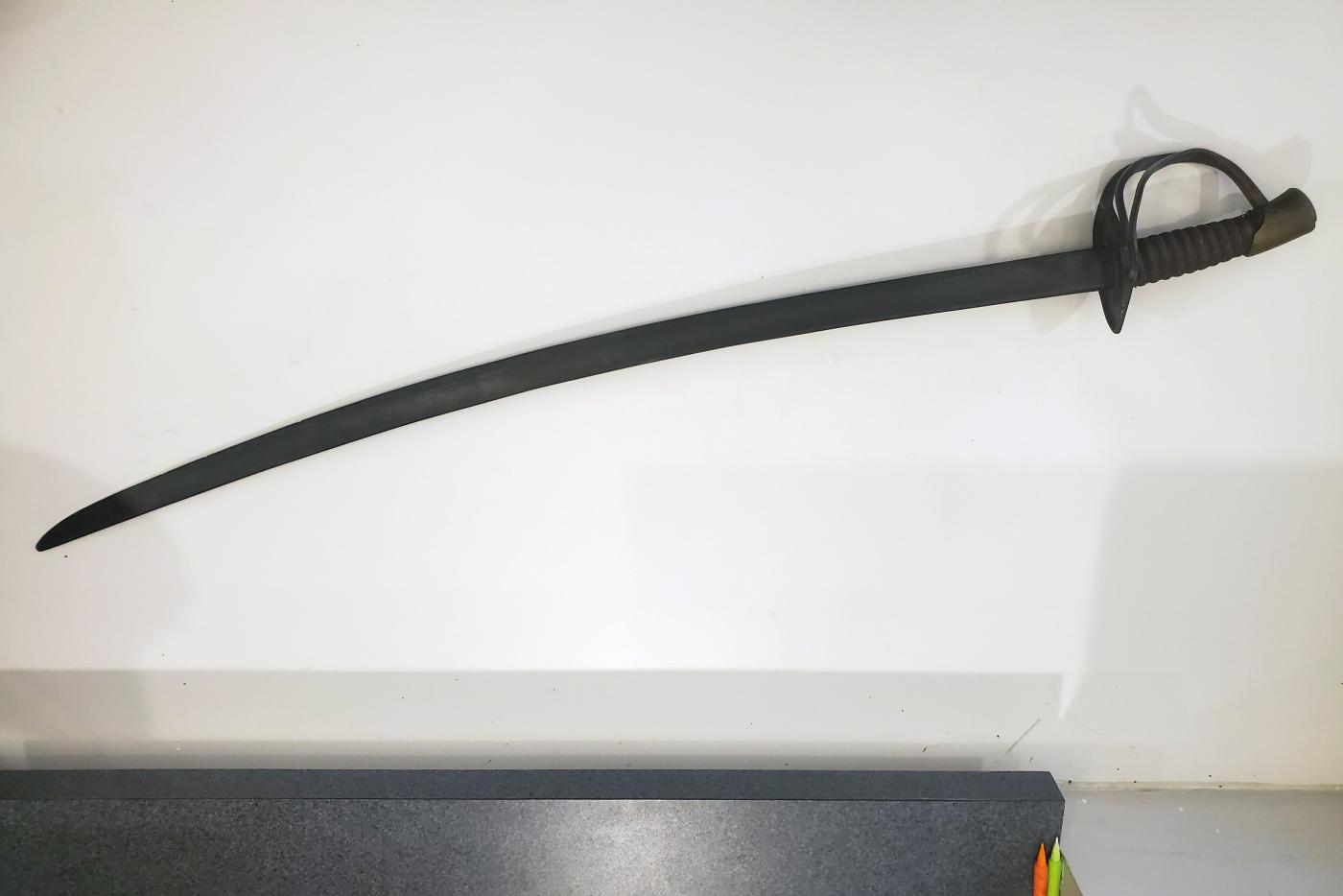 A civil war era sword in a museum.