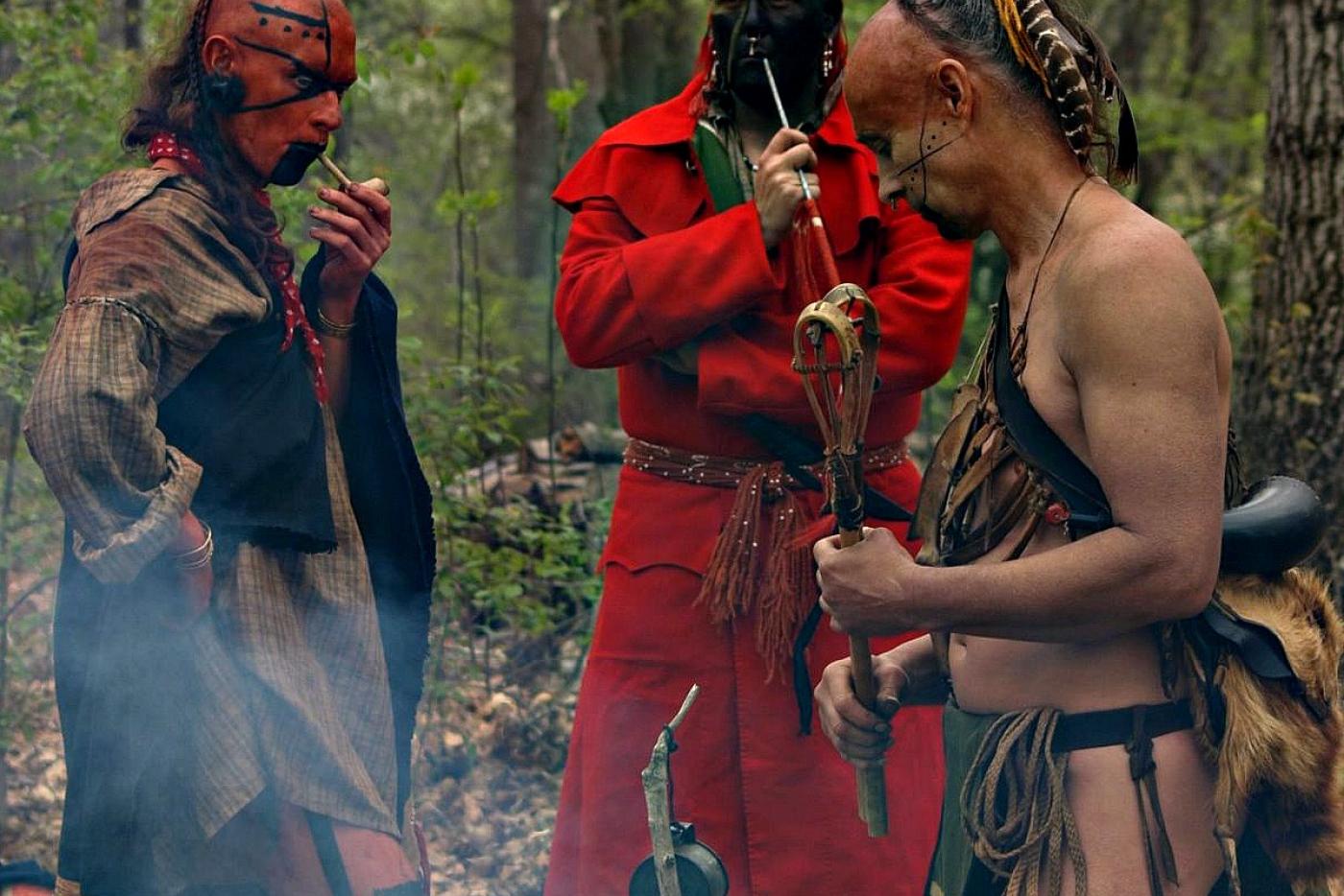 Historical interpreters dressed in traditional Cherokee attire.