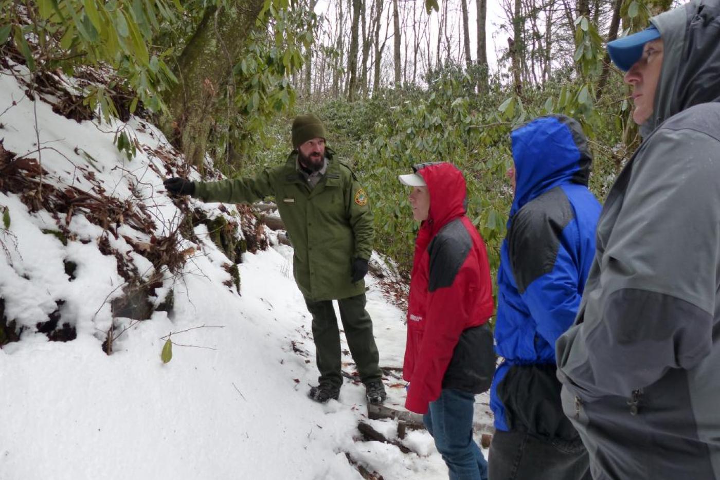 People hiking on a snowy trail 