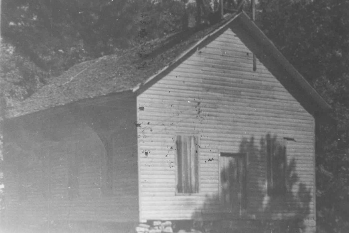 A black and white photo of the Goshen Presbyterian Church.